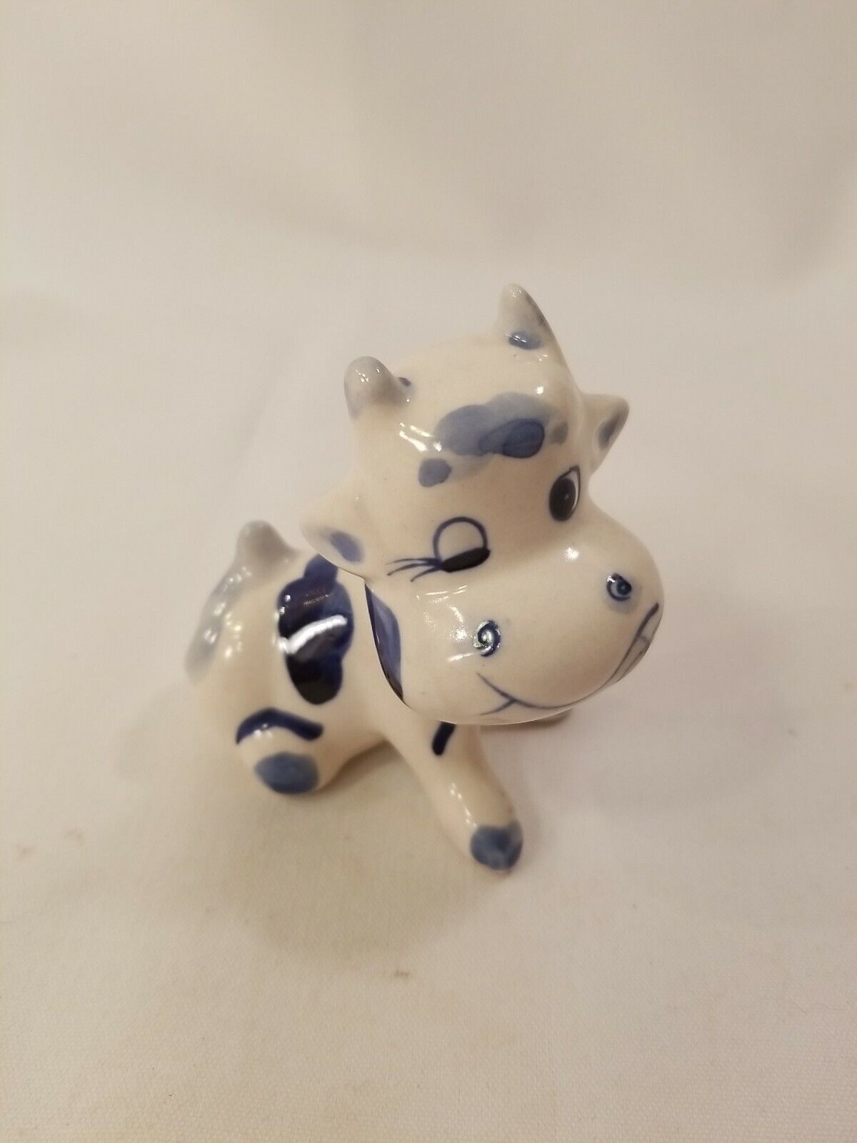 Vintage Blue & White Sitting Cow Figurine Hand Painted Winking Cow